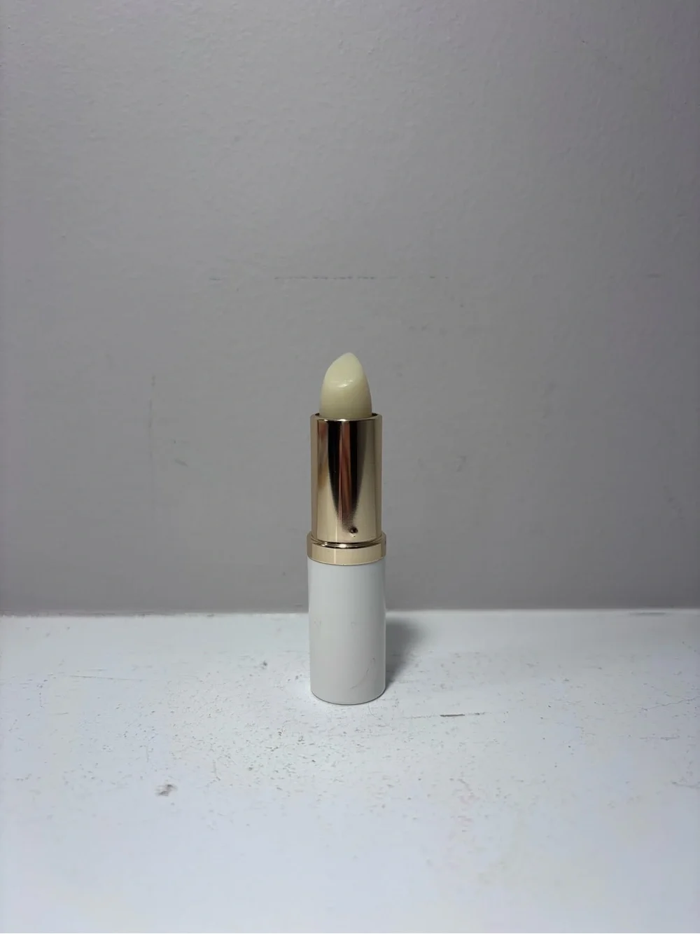 Estée Lauder Lip Conditioner Lipstick .13 Fl Oz - White Tube with Gold Accent